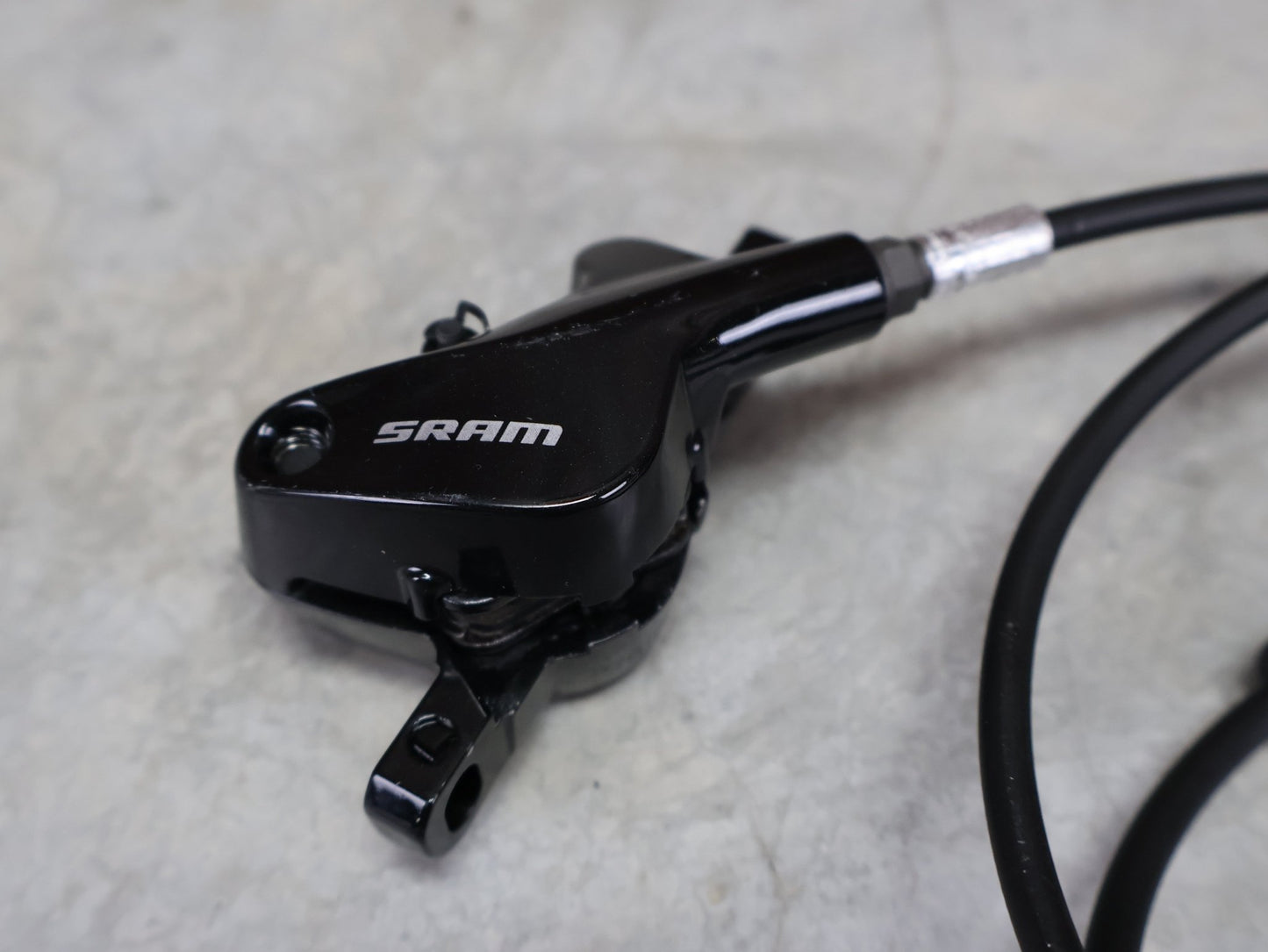 Bremse von Sram, SRAM LEVEL TL BREMSSET VORNE U. HINTEN SCHWARZ vor USEDBIKES - OB.DE Hintergrund