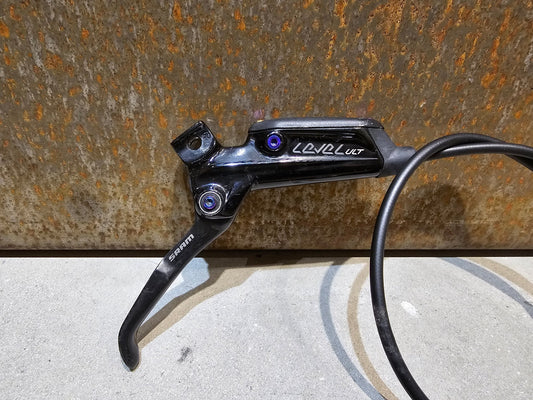 Bremse von Sram, SRAM LEVEL ULTIMATE BREMSE SCHWARZ / RAINBOW GEBRAUCHT in variant_title vor USEDBIKES - OB.DE Hintergrund