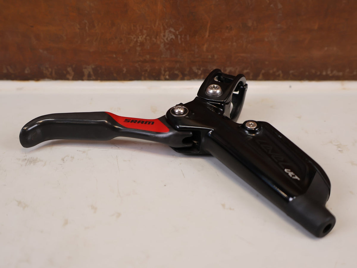 Bremse von Sram, SRAM Level Ultimate Bremsen Set Red Nino Schurter vor USEDBIKES-OB.DE Hintergrund