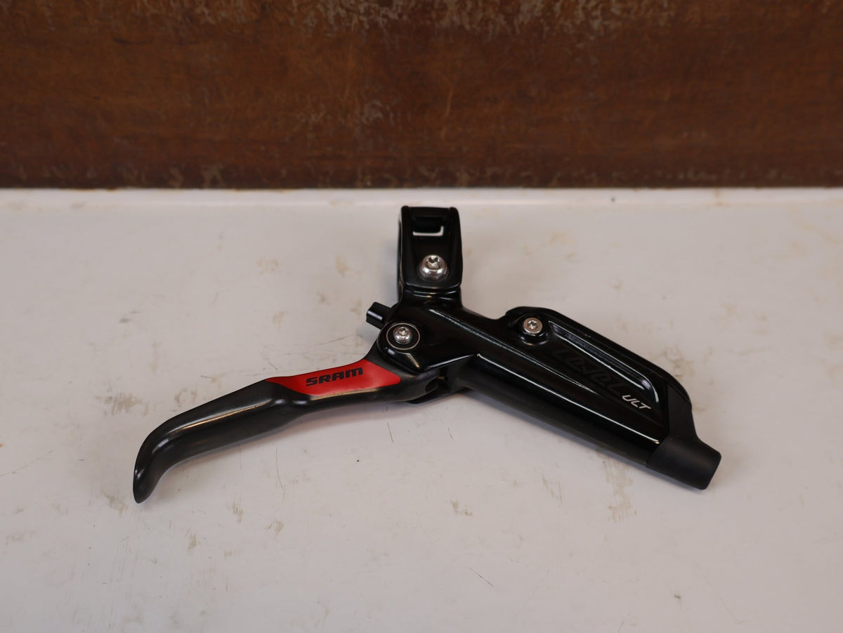 Bremse von Sram, SRAM Level Ultimate Bremsen Set Red Nino Schurter vor USEDBIKES-OB.DE Hintergrund