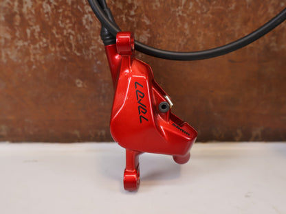 Bremse von Sram, SRAM Level Ultimate Bremsen Set Red Nino Schurter vor USEDBIKES-OB.DE Hintergrund