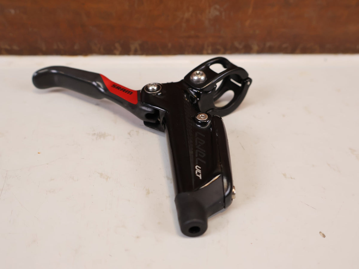 Bremse von Sram, SRAM Level Ultimate Bremsen Set Red Nino Schurter vor USEDBIKES-OB.DE Hintergrund