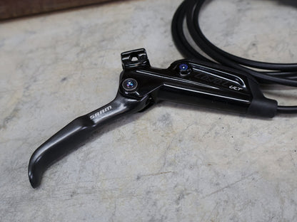 Bremse von Sram, SRAM LEVEL ULTIMATE BREMSSET VORNE U. HINTEN SCHWARZ / RAINBOW vor USEDBIKES - OB.DE Hintergrund