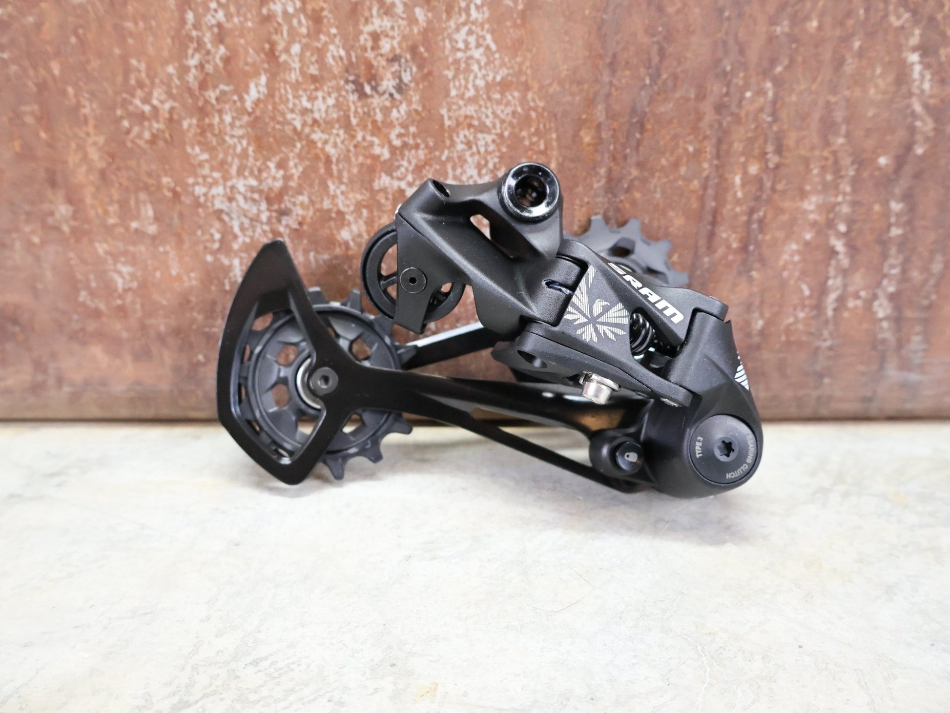 Schaltungsteile von Sram, SRAM NX EAGLE SCHALTWERK 12 FACH vor USEDBIKES - OB.DE Hintergrund