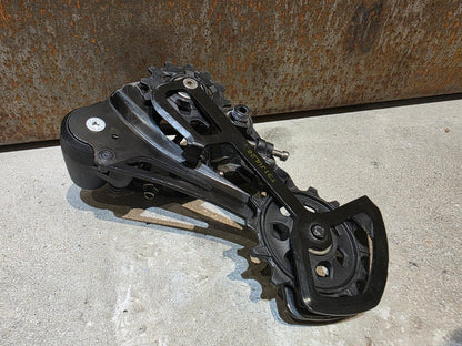 Schaltungsteile von Sram, SRAM NX EAGLE SCHALTWERK 12 FACH vor USEDBIKES - OB.DE Hintergrund