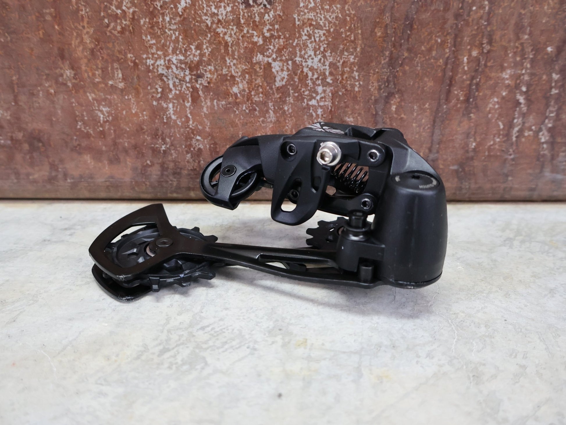 Schaltungsteile von Sram, SRAM NX EAGLE SCHALTWERK 12 FACH vor USEDBIKES - OB.DE Hintergrund