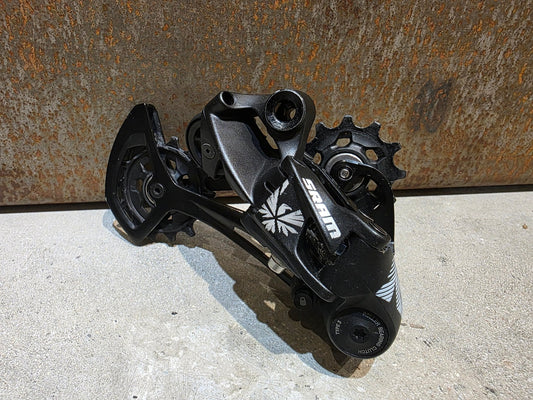 Schaltungsteile von Sram, SRAM NX EAGLE SCHALTWERK 12 FACH vor USEDBIKES - OB.DE Hintergrund
