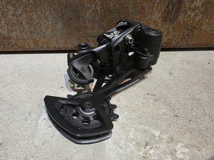 Schaltungsteile von Sram, SRAM NX EAGLE SCHALTWERK 12 FACH vor USEDBIKES - OB.DE Hintergrund
