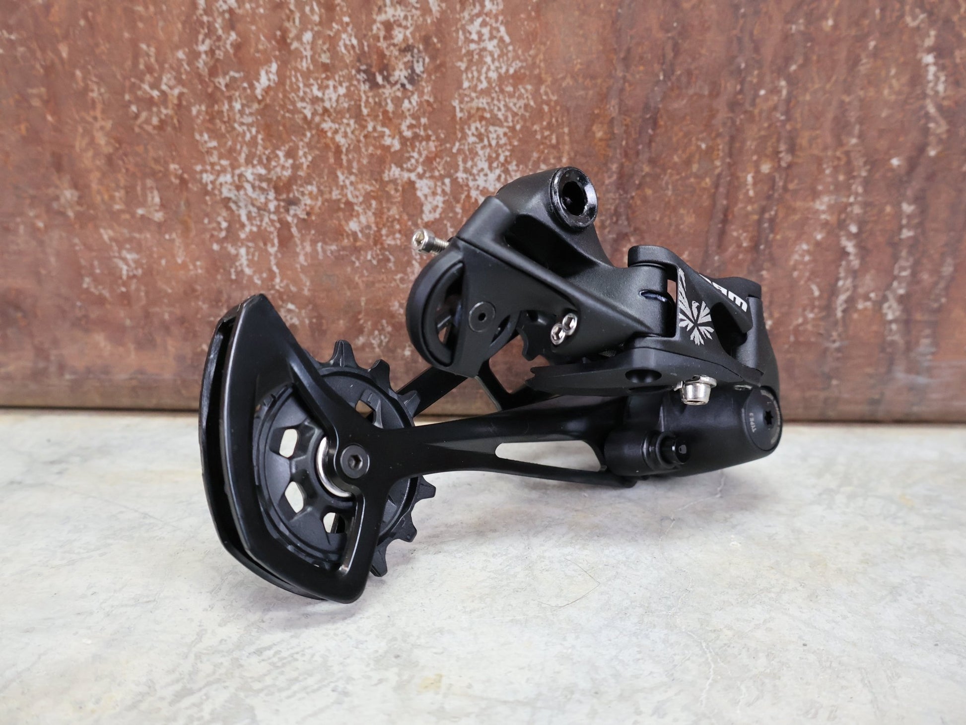 Schaltungsteile von Sram, SRAM NX EAGLE SCHALTWERK 12 FACH vor USEDBIKES - OB.DE Hintergrund