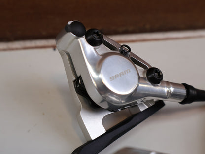 Brems-/ Schalthebel von Sram, SRAM RED AXS E1 SCHALT-BREMSHEBEL + HYDR. SCHEIBENBREMSE SET vor USEDBIKES-OB.DE Hintergrund