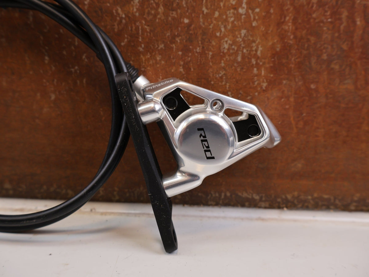 Brems-/ Schalthebel von Sram, SRAM RED AXS E1 Schalt Bremshebel Set Flatmount vor USEDBIKES-OB.DE Hintergrund