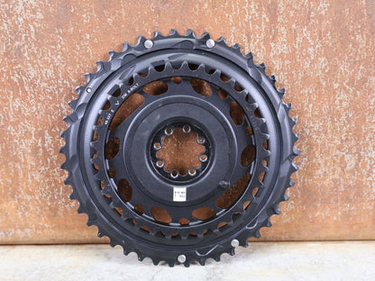 Kettenblatt von Sram, SRAM RED AXS KETTENBLATT - SET 46 - 33 ZÄHNE – 8 - BOLT / 12 - FACH vor USEDBIKES - OB.DE Hintergrund