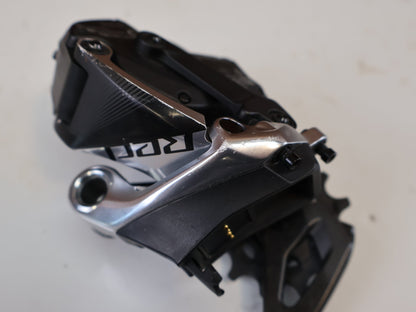 Schaltungsteile von Sram, SRAM RED ETAP AXS SCHALTWERK 12 FACH 33T CARBON KERAMIK LAGER vor USEDBIKES-OB.DE Hintergrund