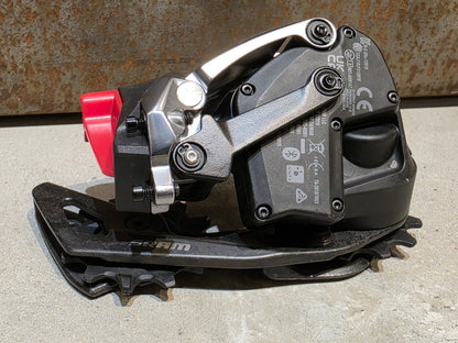 Schaltungsteile von Sram, SRAM RED ETAP AXS SCHALTWERK 12 FACH D1 / 33T vor USEDBIKES - OB.DE Hintergrund