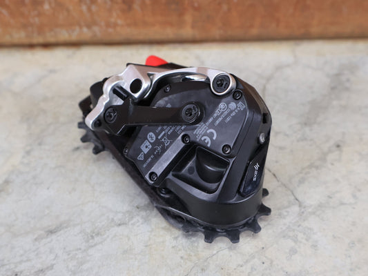 Schaltungsteile von Sram, SRAM RED ETAP AXS SCHALTWERK E1 / 12 - FACH – MAX. 36T – WIRELESS vor USEDBIKES - OB.DE Hintergrund