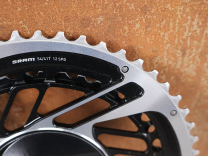 Kettenblatt von Sram, SRAM RED QUARQ AXS POWERMETER KIT 8 - BOLT SPIDER 2X12 54/41 ZÄHNE / BASTLERWARE vor USEDBIKES - OB.DE Hintergrund