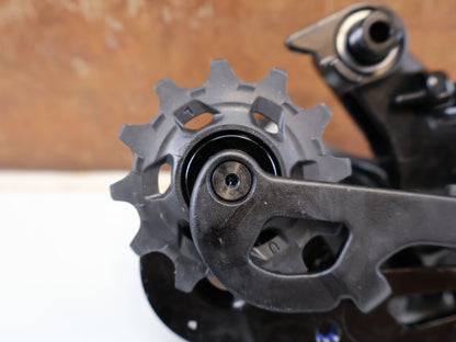 Schaltungsteile von Sram, SRAM RED XPLR ETAP AXS SCHALTWERK / 12-FACH / 10-44T / KERAMIKLAGER vor USEDBIKES-OB.DE Hintergrund