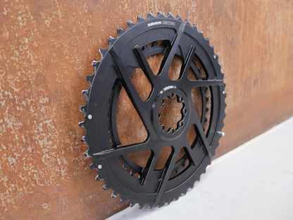 Kettenblatt von Sram, SRAM Rival E1 Kettenblattsatz 48-35T 8-Bolt 2x12 204g vor USEDBIKES-OB.DE Hintergrund