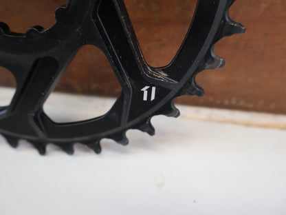Kettenblatt von Sram, SRAM X SYNC 2 KETTENBLATT 6 MM OFFSET 34T / 36T / 3 BOLT vor USEDBIKES-OB.DE Hintergrund