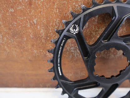 Kettenblatt von Sram, SRAM X SYNC 2 KETTENBLATT 6 MM OFFSET 34T / 36T / 3 BOLT vor USEDBIKES-OB.DE Hintergrund