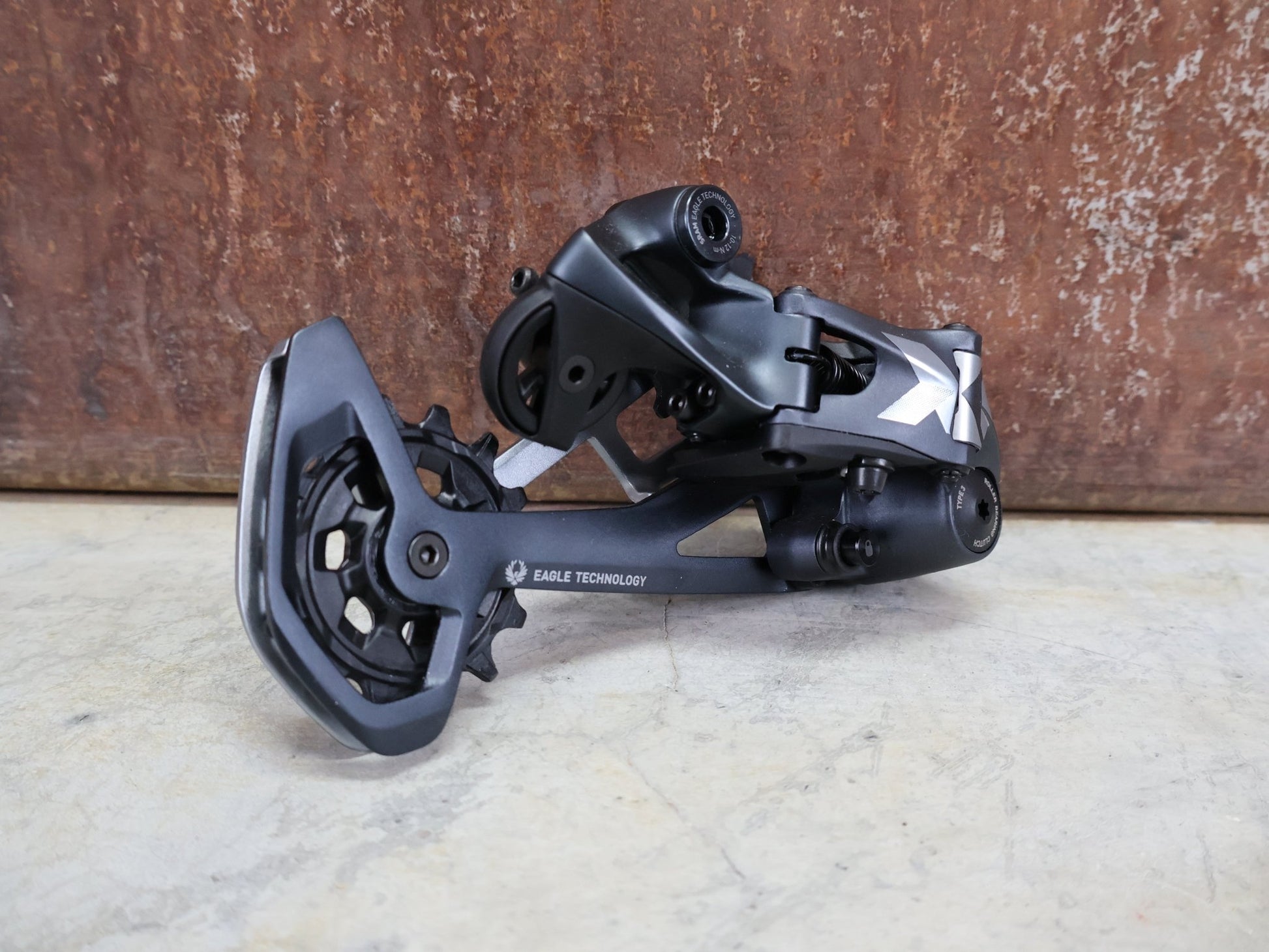 Schaltungsteile von Sram, SRAM X01 EAGLE SCHALTWERK 520% 12 FACH vor USEDBIKES - OB.DE Hintergrund