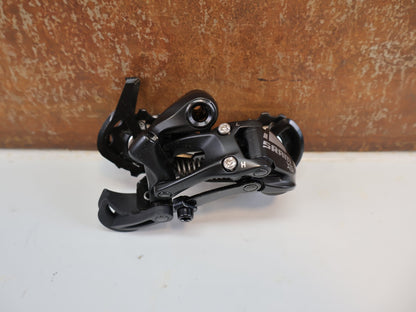 Schaltungsteile von Sram, SRAM X5 SCHALTWERK / 9 - FACH / MITTELLANG / 1:1 ACTUATION / BLACK vor USEDBIKES - OB.DE Hintergrund