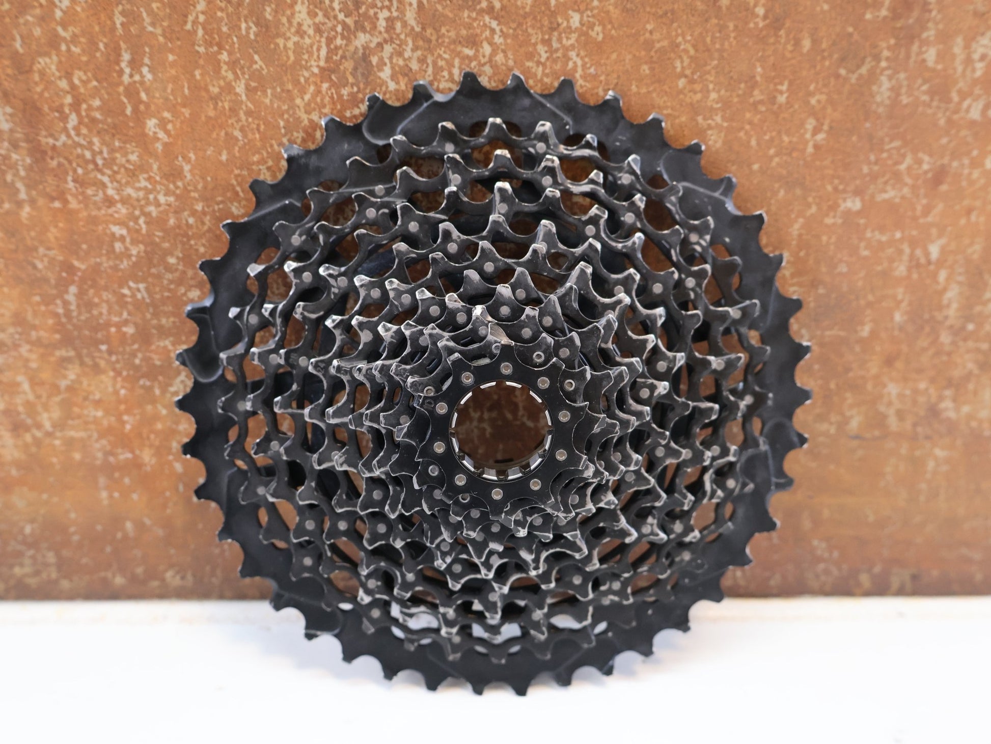 Kassette & Zahnkränze von Sram, SRAM XG-1175 KASSETTE / 11-FACH MTB KASSETTE / XD-FREILAUF / 10-42 Z vor USEDBIKES-OB.DE Hintergrund