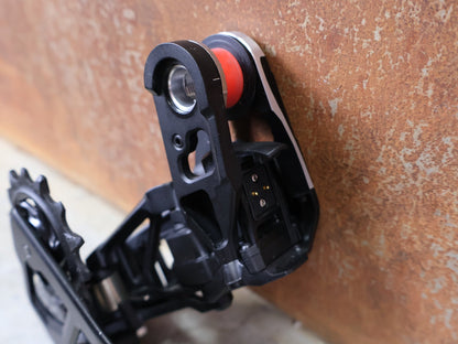 Schaltungsteile von Sram, SRAM XX SL EAGLE AXS T - TYPE SCHALTWERK / 12 - FACH – 10–52T – SILBER vor USEDBIKES - OB.DE Hintergrund