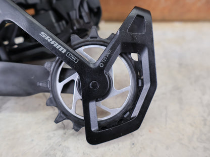 Schaltungsteile von Sram, SRAM XX SL EAGLE AXS T - TYPE SCHALTWERK / 12 - FACH – 10–52T – SILBER vor USEDBIKES - OB.DE Hintergrund