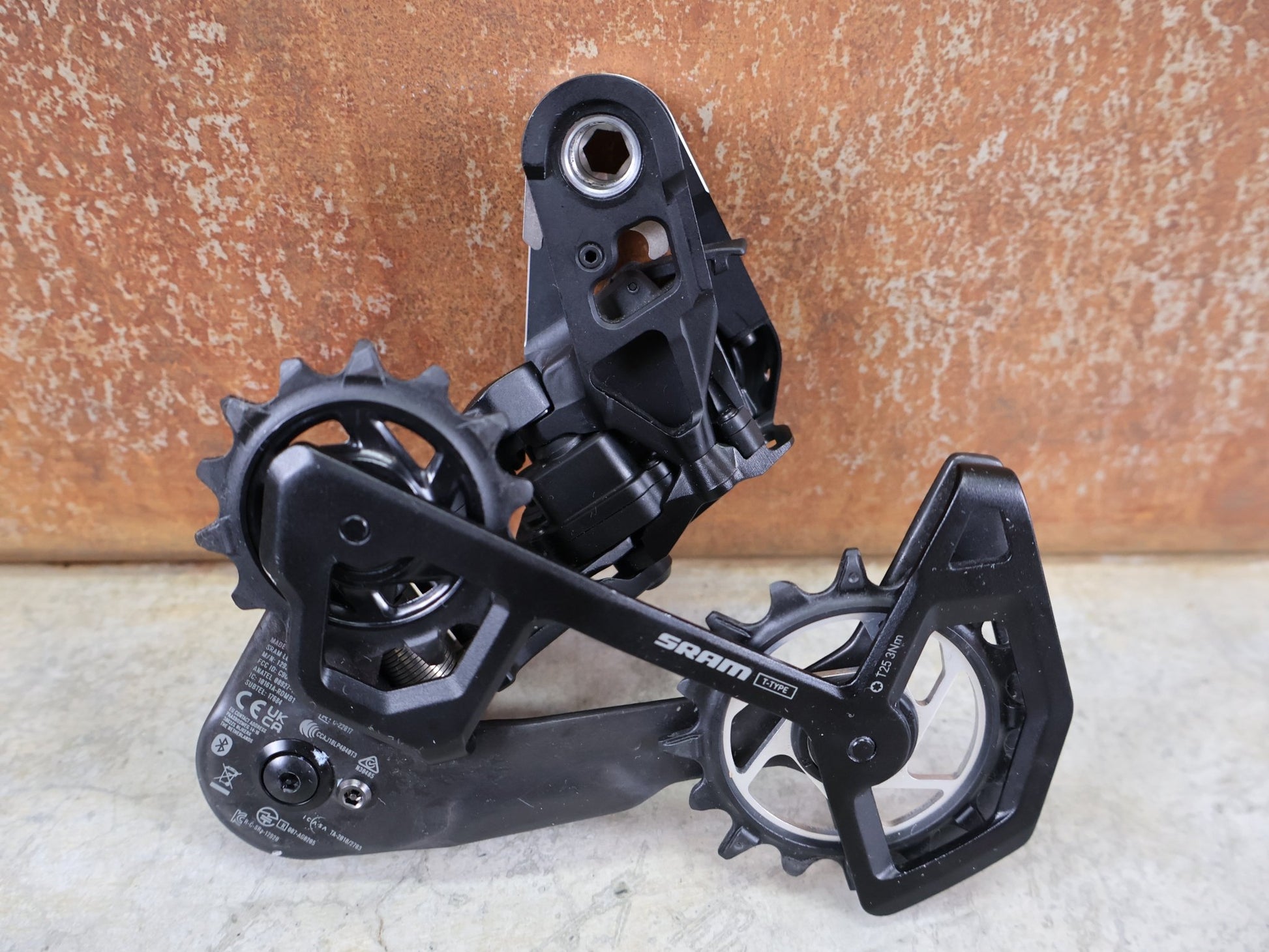 Schaltungsteile von Sram, SRAM XX SL EAGLE AXS T - TYPE SCHALTWERK / 12 - FACH – 10–52T – SILBER vor USEDBIKES - OB.DE Hintergrund