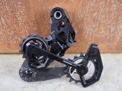 Schaltungsteile von Sram, SRAM XX SL EAGLE AXS T - TYPE SCHALTWERK / 12 - FACH – 10–52T – SILBER vor USEDBIKES - OB.DE Hintergrund