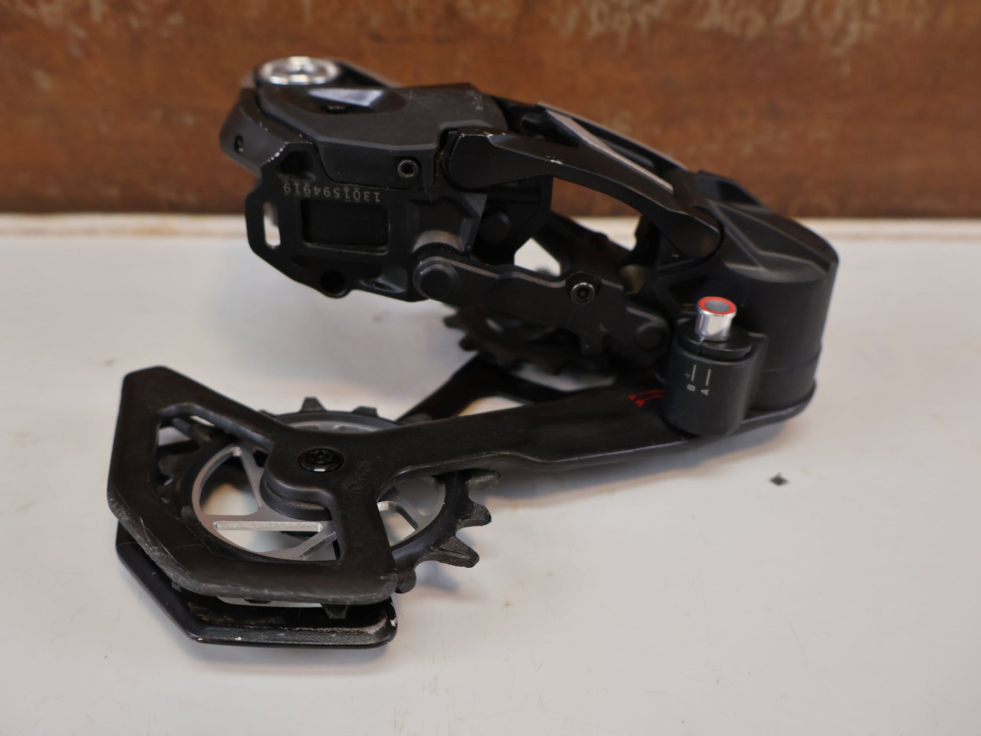 Schaltungsteile von Sram, SRAM XX SL EAGLE AXS T-TYPE SCHALTWERK / 12-FACH TRANSMISSION CARBON MTB vor USEDBIKES-OB.DE Hintergrund