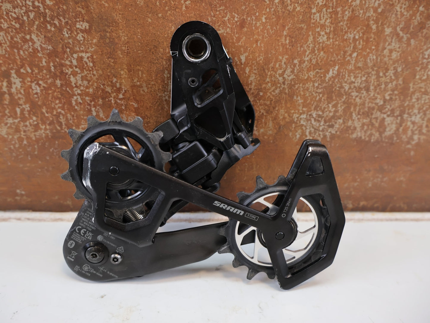 Schaltungsteile von Sram, SRAM XX SL EAGLE AXS T-TYPE SCHALTWERK / 12-FACH TRANSMISSION CARBON MTB vor USEDBIKES-OB.DE Hintergrund