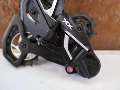 Schaltungsteile von Sram, SRAM XX SL EAGLE AXS T-TYPE SCHALTWERK / 12-FACH TRANSMISSION CARBON MTB vor USEDBIKES-OB.DE Hintergrund