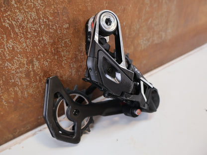 Schaltungsteile von Sram, SRAM XX SL EAGLE AXS T-TYPE SCHALTWERK / 12-FACH TRANSMISSION CARBON MTB vor USEDBIKES-OB.DE Hintergrund