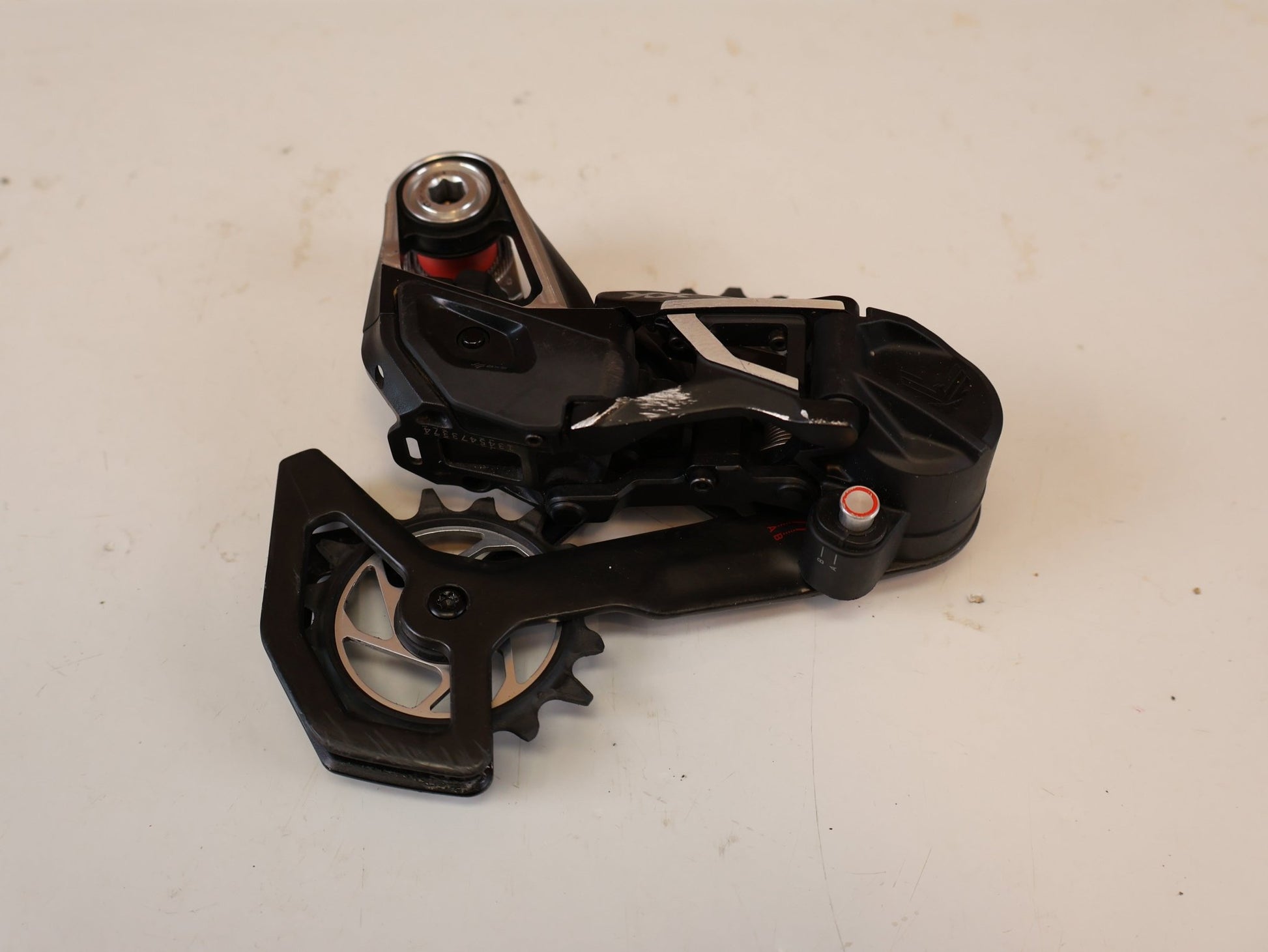 Schaltungsteile von Sram, SRAM XX SL EAGLE AXS T TYPE SCHALTWERK 12 FACH TRANSMISSION vor USEDBIKES-OB.DE Hintergrund