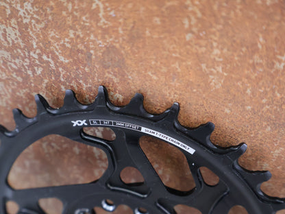 Kettenblatt von Sram, SRAM XX SL EAGLE T - TYPE KETTENBLATT / 34 ZÄHNE / 3MM OFFSET / 8 - BOLT / 1X12 - FACH vor USEDBIKES - OB.DE Hintergrund