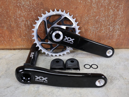 Kurbel von Sram, SRAM XX SL EAGLE TRANSMISSION KURBELGARNITUR – DUB MTB WIDE / 55 MM – 165 MM – 34 Z vor USEDBIKES - OB.DE Hintergrund