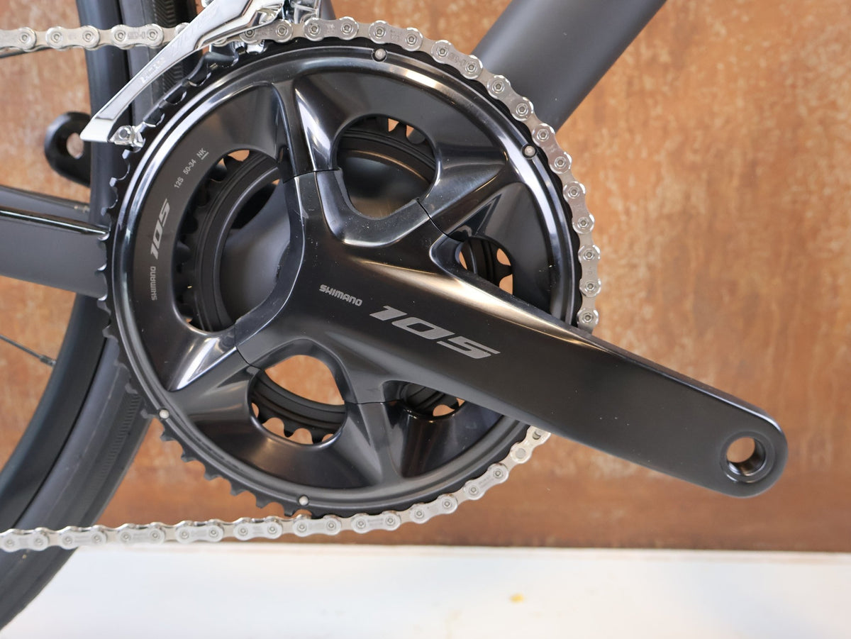 Rennrad von Trek, TREK DOMANE SL 5 GEN 5 MATTE DEEP SMOKE / L vor USEDBIKES-OB.DE Hintergrund