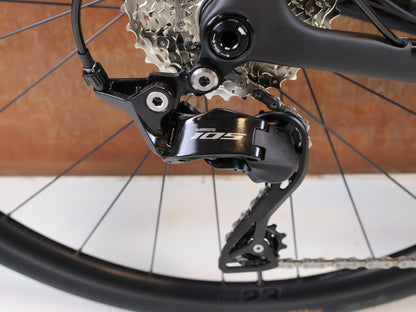 Rennrad von Trek, TREK DOMANE SL 5 GEN 5 MATTE DEEP SMOKE / M vor USEDBIKES-OB.DE Hintergrund