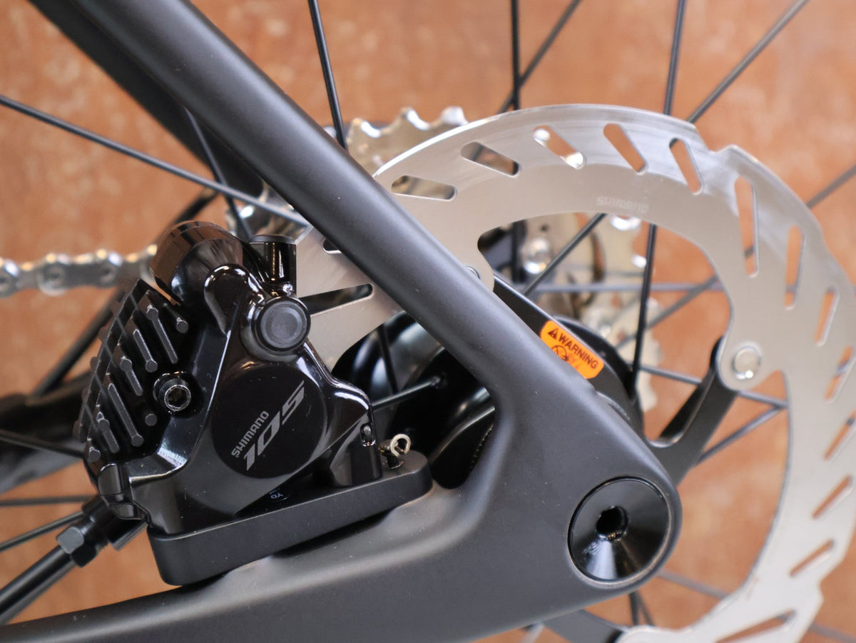 Rennrad von Trek, TREK DOMANE SL 5 GEN 5 MATTE DEEP SMOKE / S vor USEDBIKES-OB.DE Hintergrund