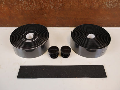 Griffe und Lenkerbänder von Trek, TREK DOUBLE GEL CORK LENKERBANDSET BLACK / 5327513 vor USEDBIKES-OB.DE Hintergrund