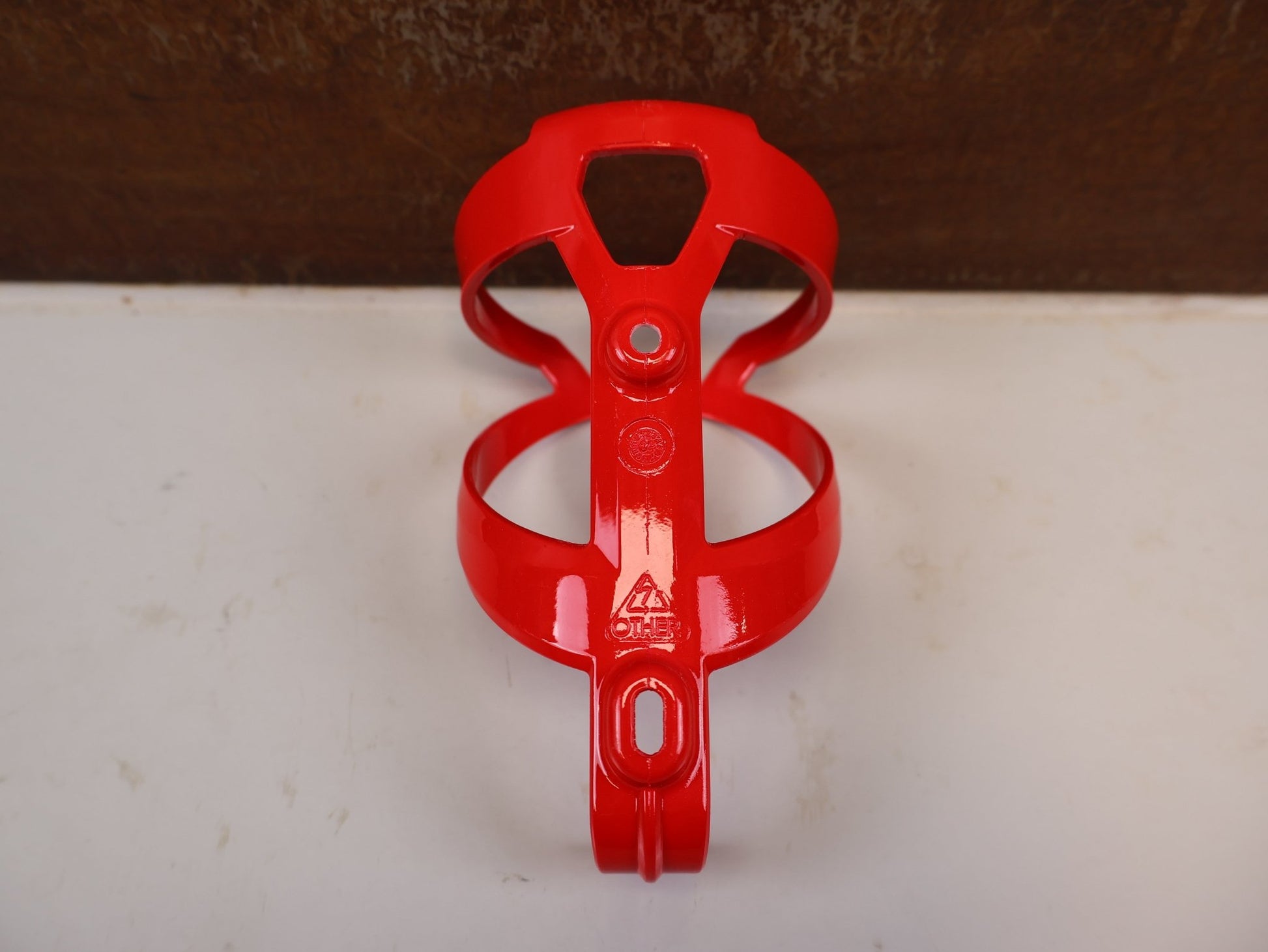 Trinkflaschen und Halter von Trek, TREK ELITE CAGE RECYCLED FLASCHENHALTER RADIOACTIVE RED vor USEDBIKES-OB.DE Hintergrund
