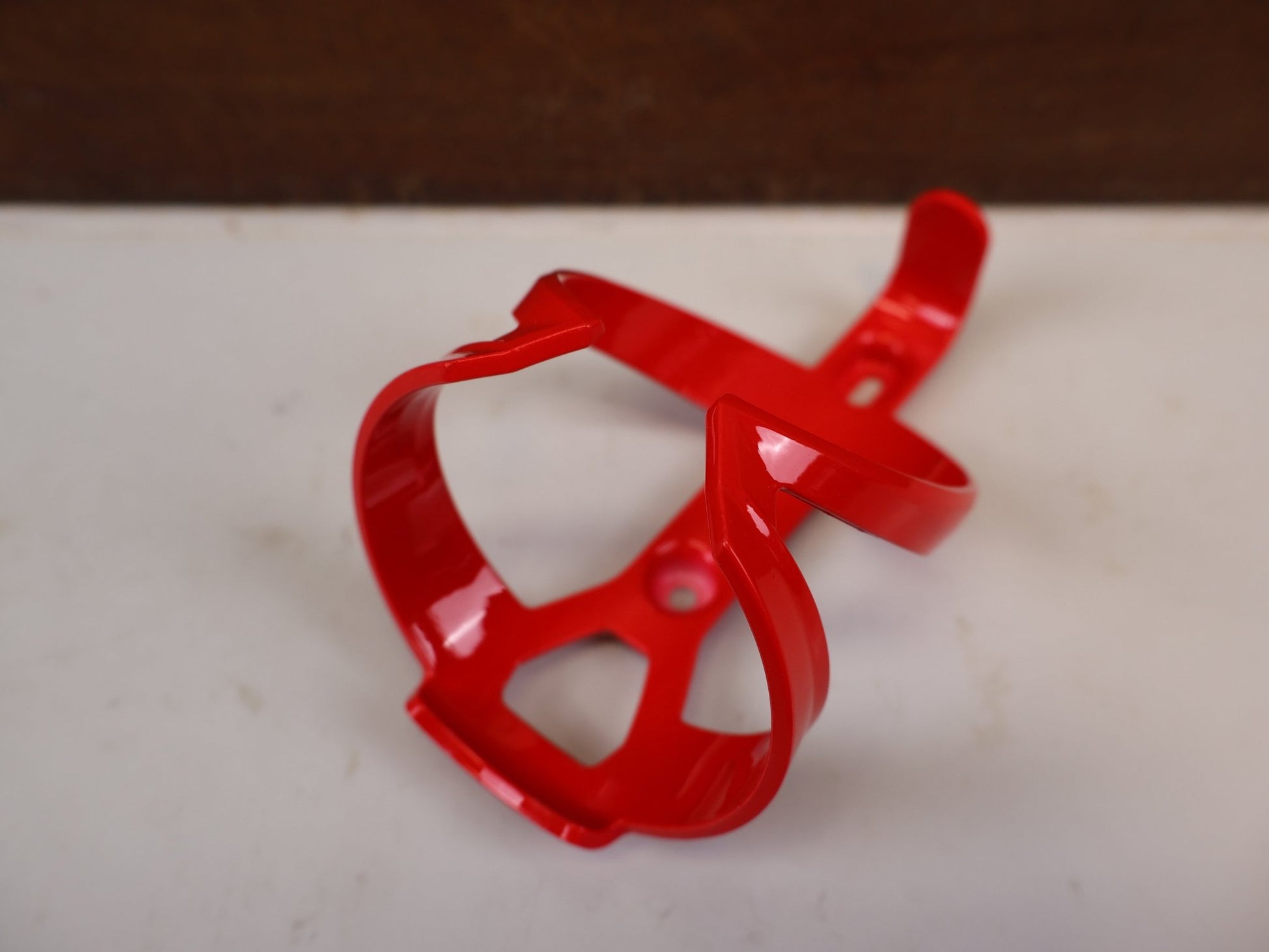 Trinkflaschen und Halter von Trek, TREK ELITE CAGE RECYCLED FLASCHENHALTER RADIOACTIVE RED vor USEDBIKES-OB.DE Hintergrund