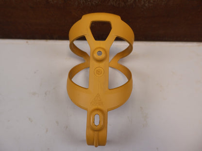Trinkflaschen und Halter von Trek, TREK ELITE RECYCLED FLASCHENHALTER BAJA YELLOW MATT / GEBRAUCHT vor USEDBIKES-OB.DE Hintergrund