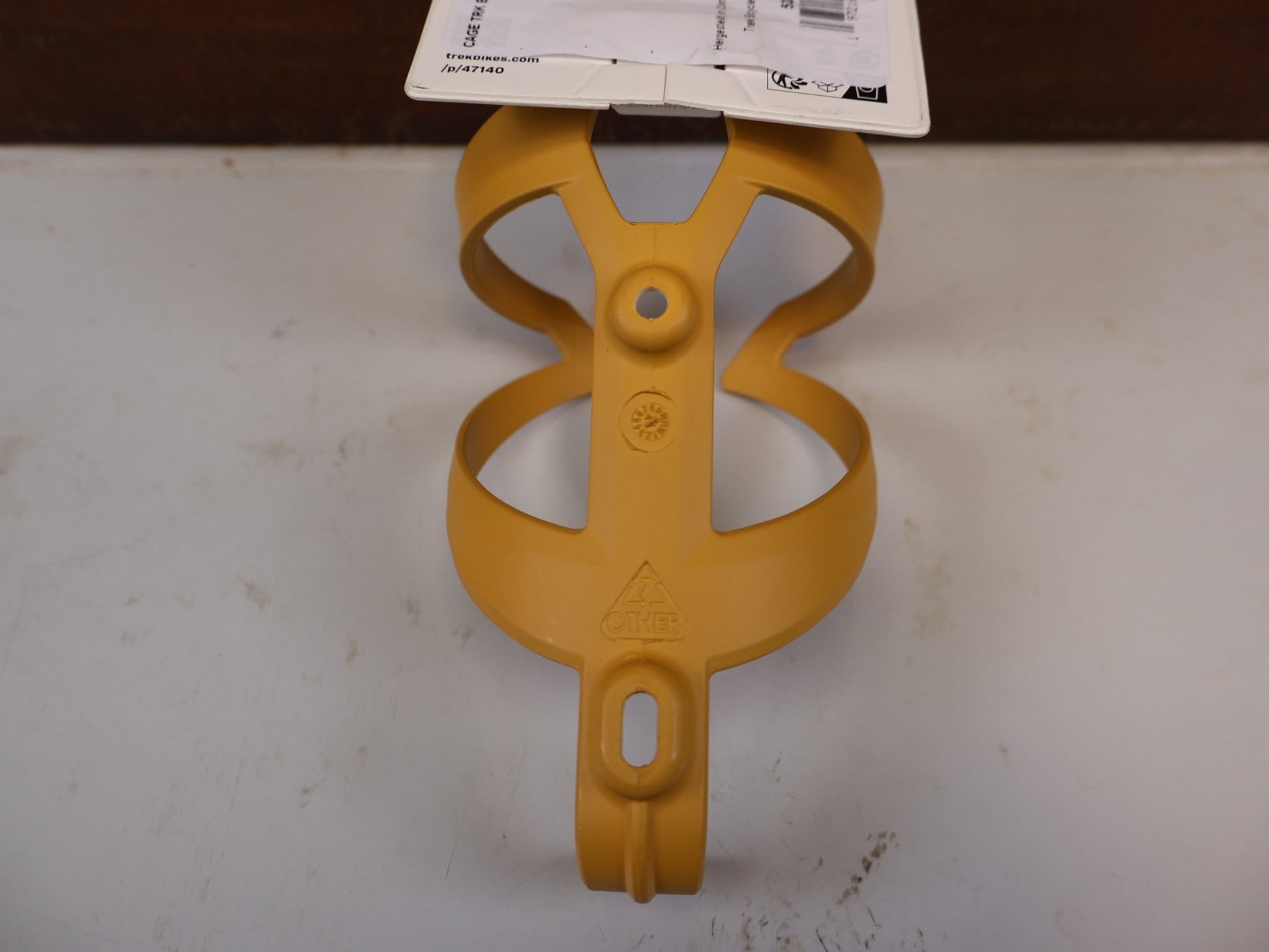 Trinkflaschen und Halter von Trek, TREK ELITE RECYCLED FLASCHENHALTER BAJA YELLOW MATT vor USEDBIKES-OB.DE Hintergrund