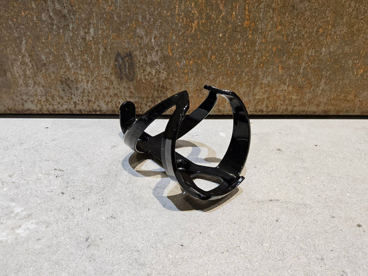 Trinkflaschen und Halter von Trek, TREK ELITE RECYCLED FLASCHENHALTER / BLACK vor USEDBIKES - OB.DE Hintergrund