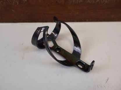 Trinkflaschen und Halter von Trek, TREK ELITE RECYCLED FLASCHENHALTER DARK PRISMATIC GOLD vor USEDBIKES-OB.DE Hintergrund