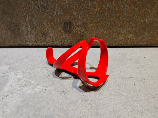 Trinkflaschen und Halter von Trek, TREK ELITE RECYCLED FLASCHENHALTER / RADIOACTIVE RED vor USEDBIKES - OB.DE Hintergrund