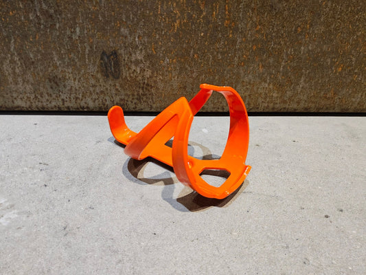 Trinkflaschen und Halter von Trek, TREK ELITE RECYCLED FLASCHENHALTER / ROARANGE vor USEDBIKES - OB.DE Hintergrund